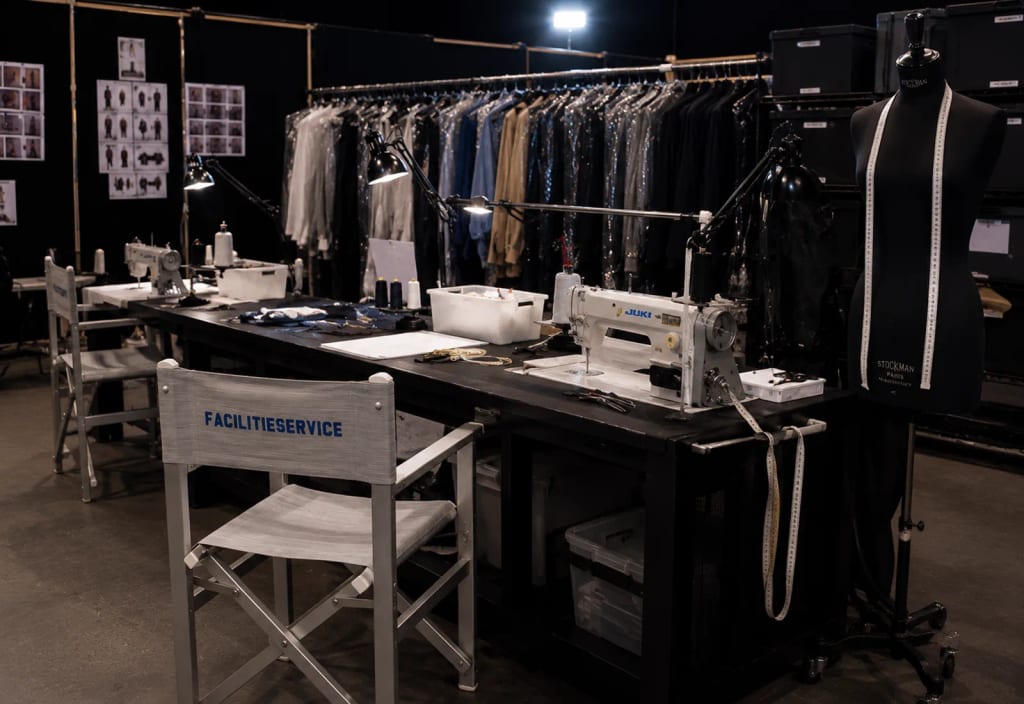 Wardrobe station with clothing, chairs and backstage materials